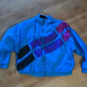 Puma Blue, purple, pink, and black wind breaker.